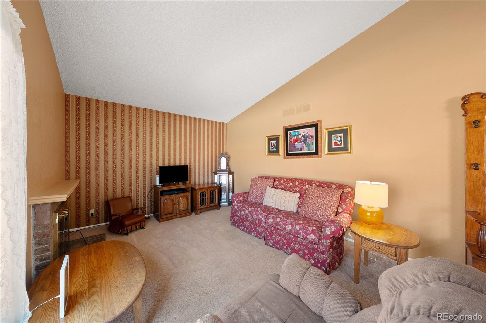 3657 South Laredo Street, Unit A Aurora, CO 80013 - Photo 6 of 26 a living room with furniture and a fireplace