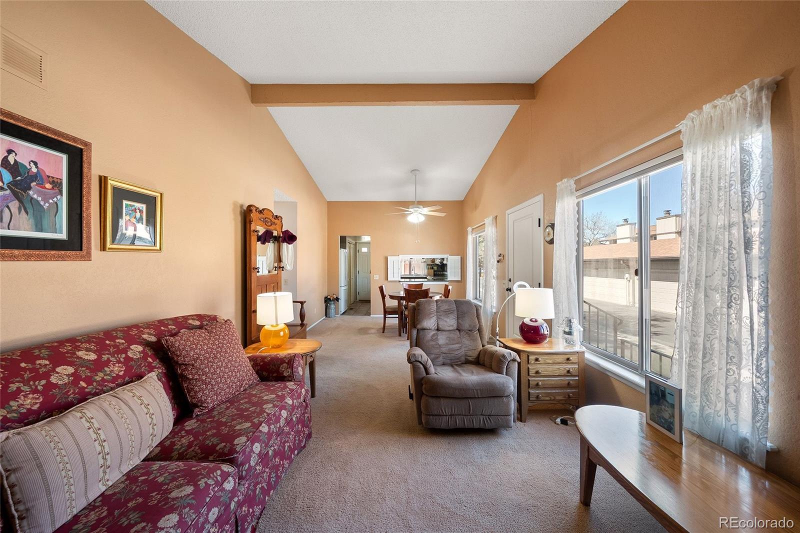 3657 South Laredo Street, Unit A Aurora, CO 80013 - Photo 8 of 26 a living room with furniture and a large window