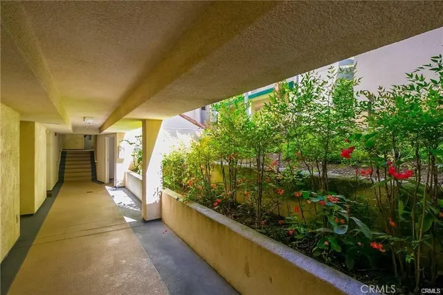 a view of a room with furniture and window