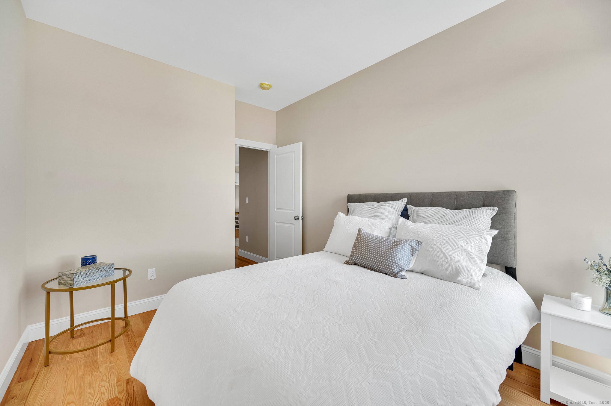 128 Webster Lane Middletown, CT 06457 - Photo 18 of 21 a bedroom with a bed and chair