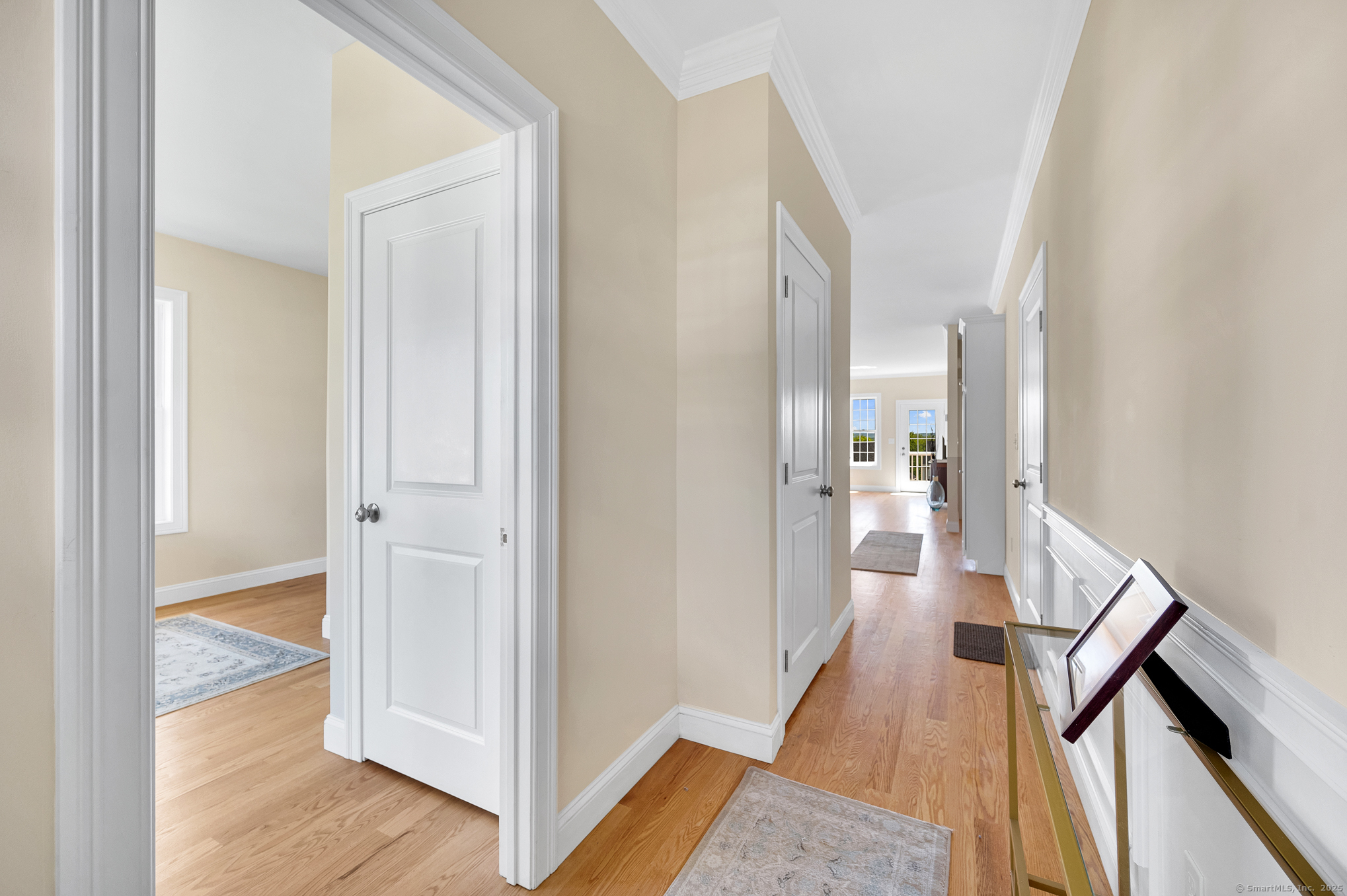 128 Webster Lane Middletown, CT 06457 - Photo 4 of 21 a view of a hallway with wooden floor and staircase