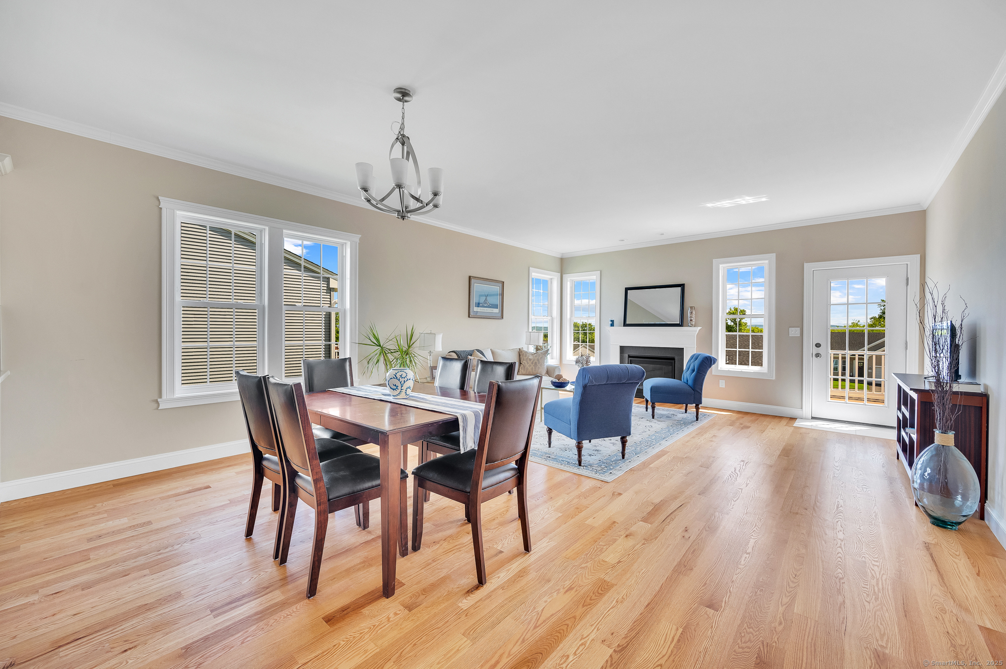 128 Webster Lane Middletown, CT 06457 - Photo 9 of 21 a view of a dining room with furniture window and wooden floor