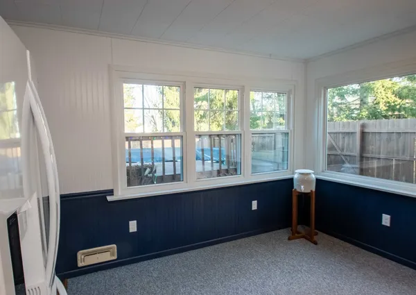 a room with a window and a desk