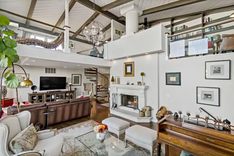 a kitchen with stainless steel appliances kitchen island granite countertop a stove a sink and a refrigerator