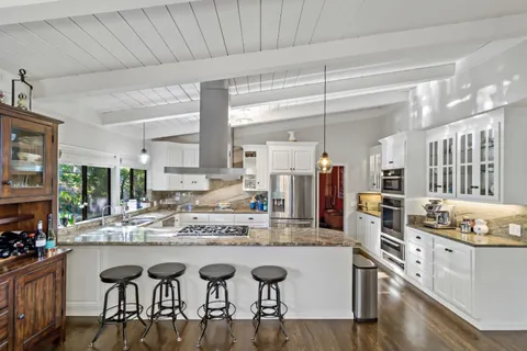 a view of a hallway with paintings on the walls