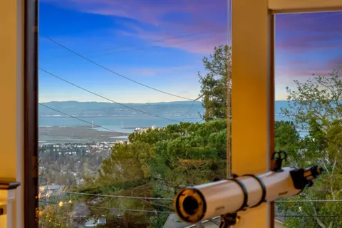 a view of a living room with furniture and a flat screen tv