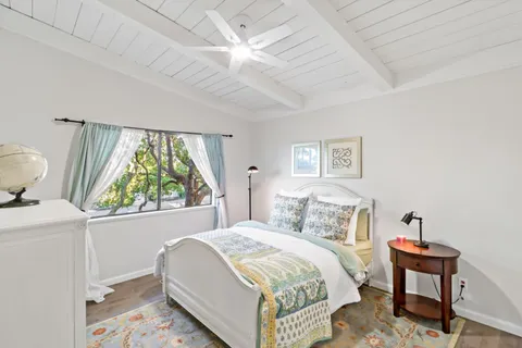 a view of a tables and chairs in a backyard