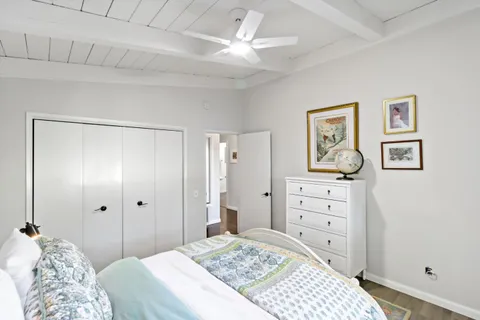 a backyard of a house with lots of green space and outdoor seating