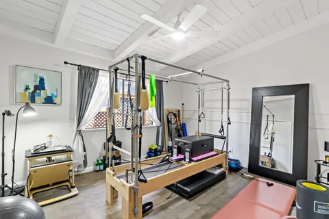 a view of a patio with table and chairs and potted plants
