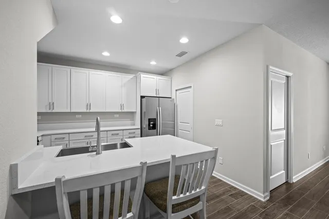 a kitchen with a stove sink and microwave