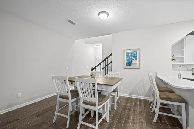a view of a dining table and chairs in a room