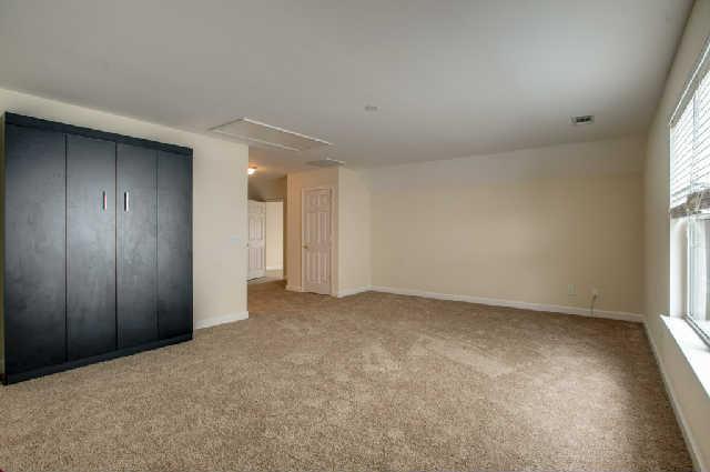1702 Decatur Circle Franklin, TN 37067 - Photo 10 of 20 This bonus room prooves to be an open space for many different types of space planning- additional living area, play area, game room, guest area, man cave. It even has a built in murphy bed that remains with the home.