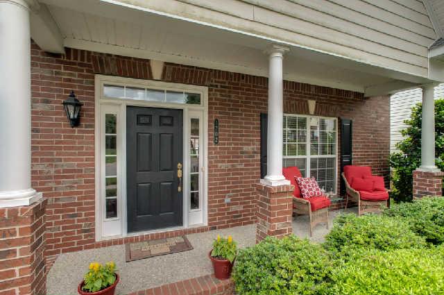 1702 Decatur Circle Franklin, TN 37067 - Photo 2 of 20 This front porch is one of the few that only takes one step to get to the front door and is at the very rear of the neighborhood and faces a heavily treed area.