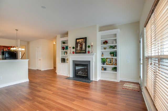 1702 Decatur Circle Franklin, TN 37067 - Photo 6 of 20 The family room with gas fireplace, natural light, and built in shelving to complete this cozy space.