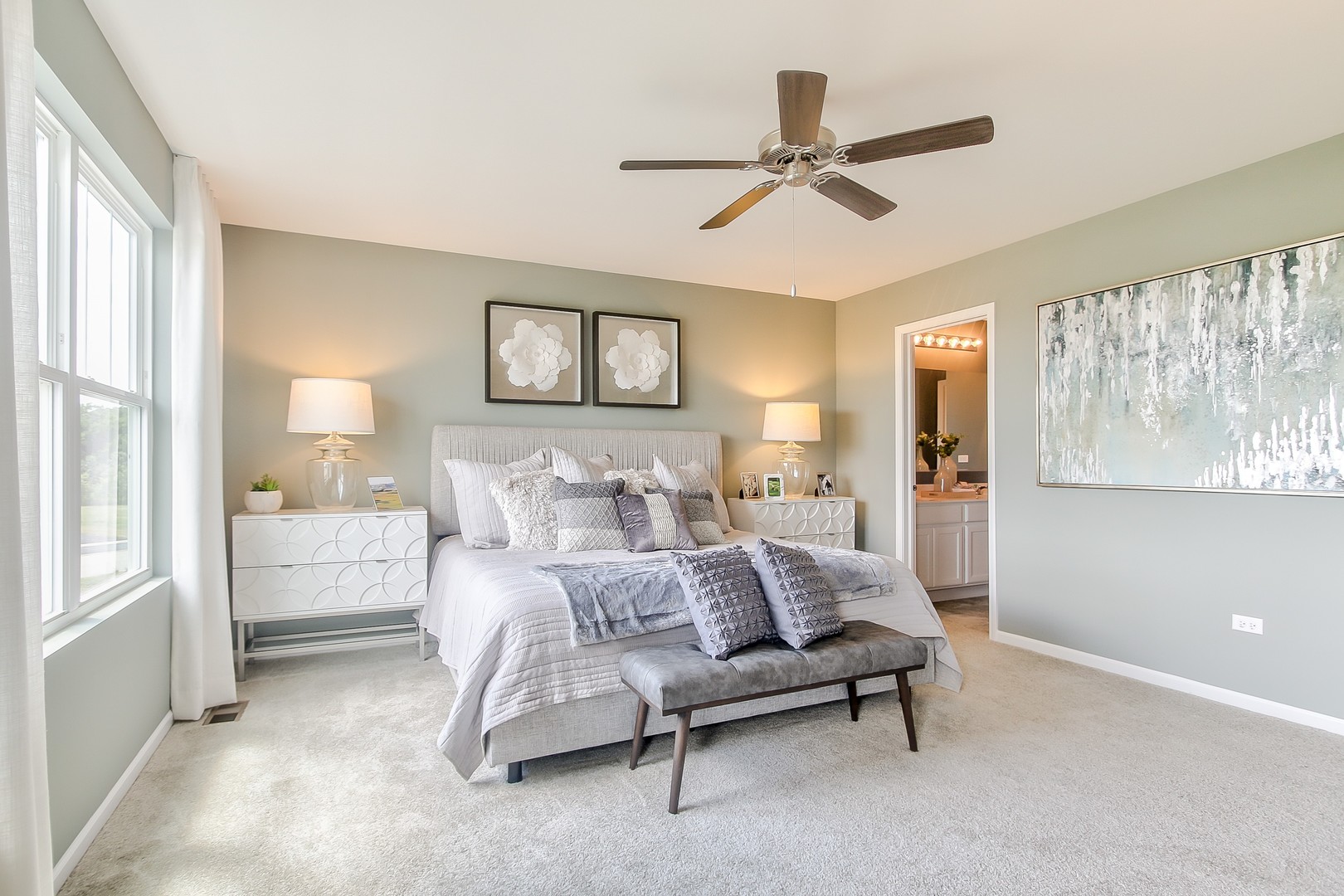 1033 Sharp Drive, Unit 1609 Plano, IL 60545 - Photo 21 of 35 a bedroom with furniture and a large window