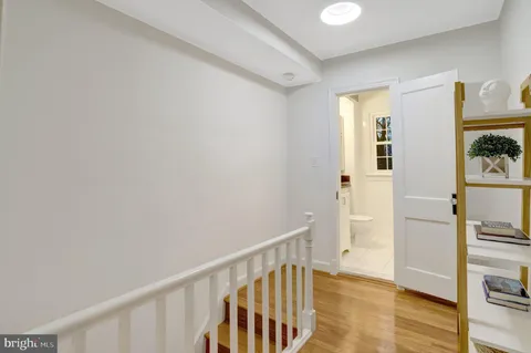 a view of an entryway with wooden floor