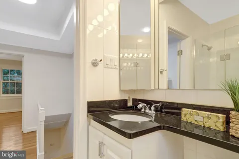 a view of a two chairs and table in the balcony