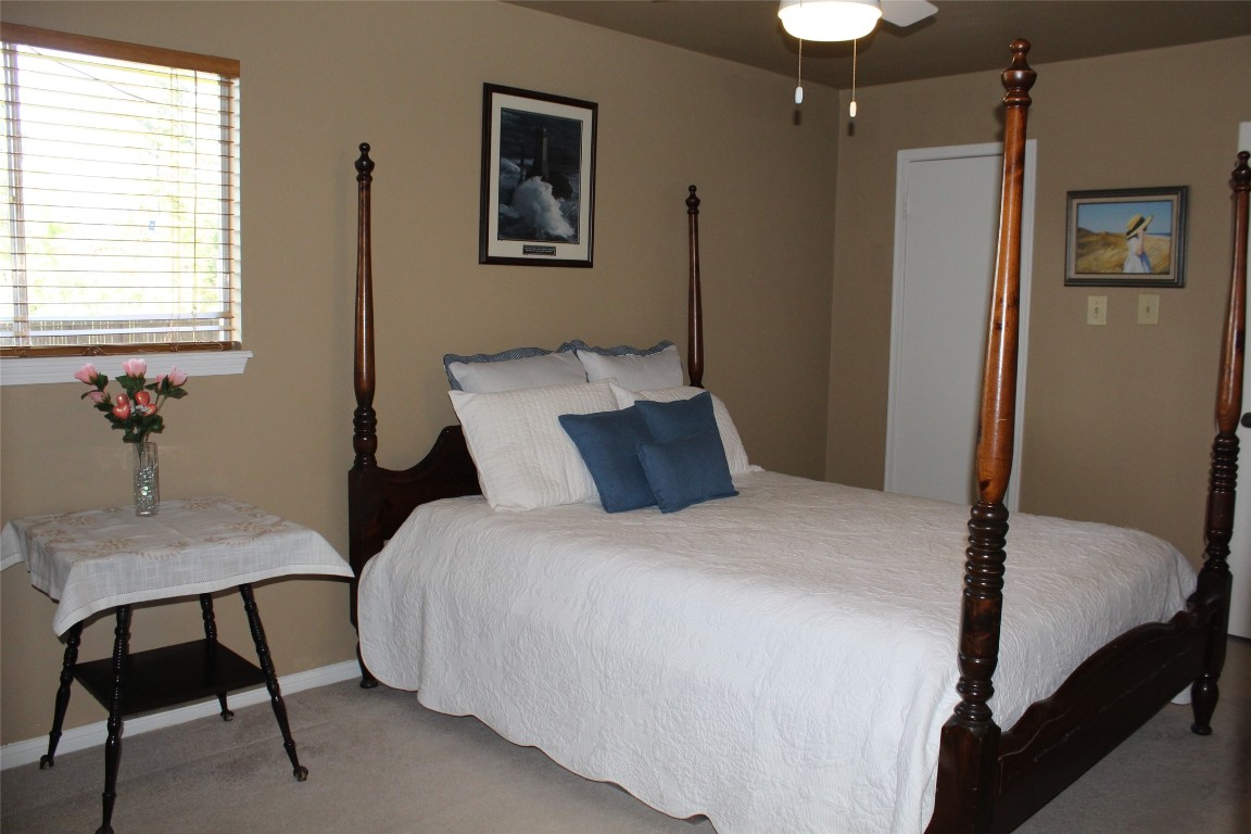 3706 Cypresswood Drive Spring, TX 77388 - Photo 23 of 30 a bedroom with a bed and a table