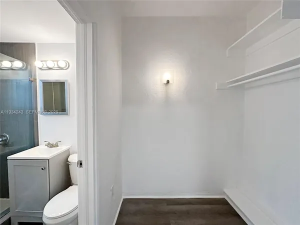 a bathroom with a sink and toilet