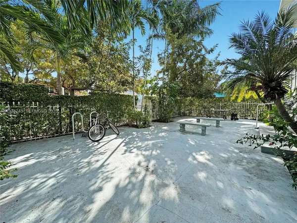 a view of a yard with swimming pool