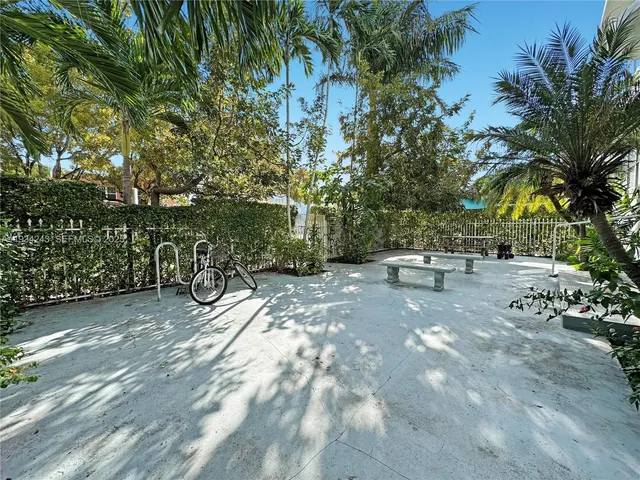 a view of a yard with swimming pool