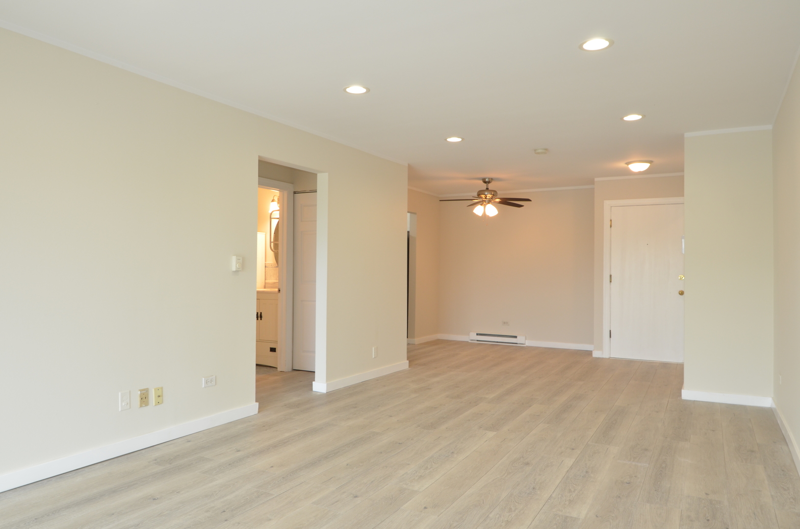 826 East Old Willow Road, Unit 206 Prospect Heights, IL 60070 - Photo 5 of 15 wooden floor in an empty room with a window