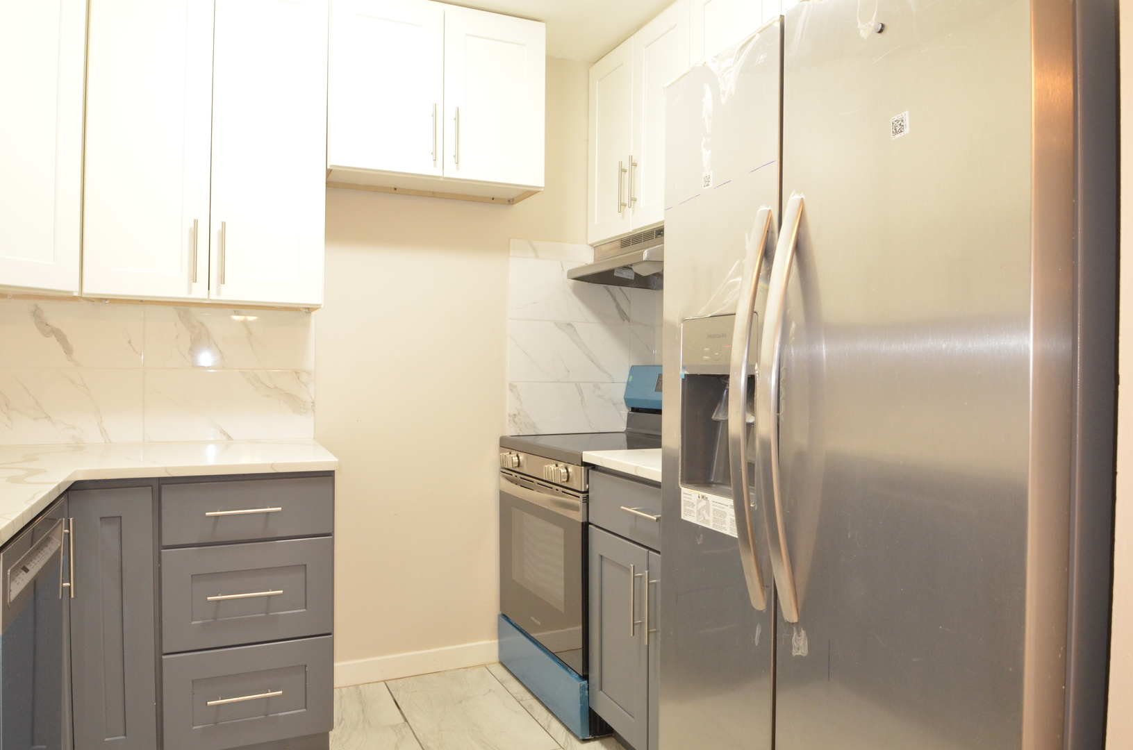 826 East Old Willow Road, Unit 206 Prospect Heights, IL 60070 - Photo 9 of 15 a kitchen with a refrigerator and cabinets