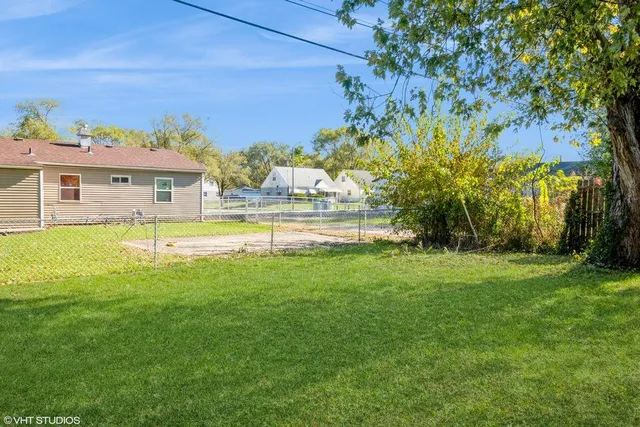 a view of a house with a big yard