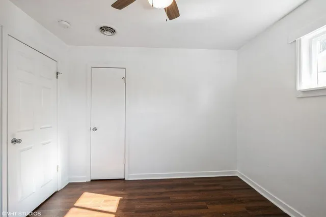 a view of room with window and hardwood floor