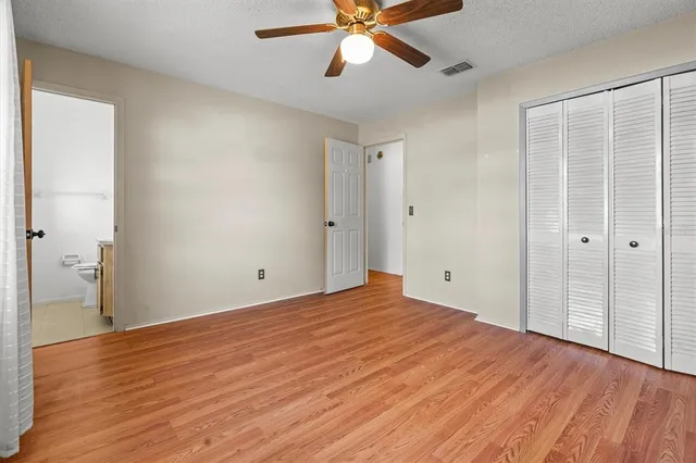 a view of an empty room and wooden floor