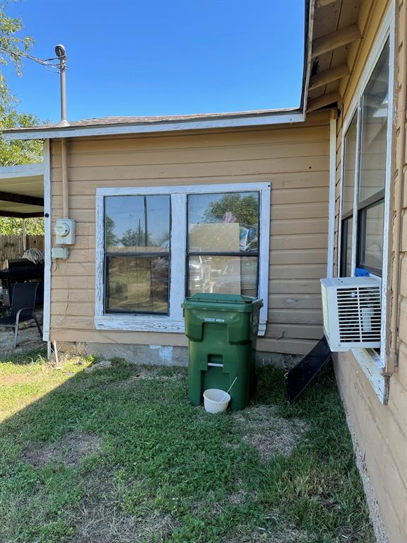 209 East Graham Avenue Godley, TX 76044 - Photo 1 of 1 a view of a house with a backyard