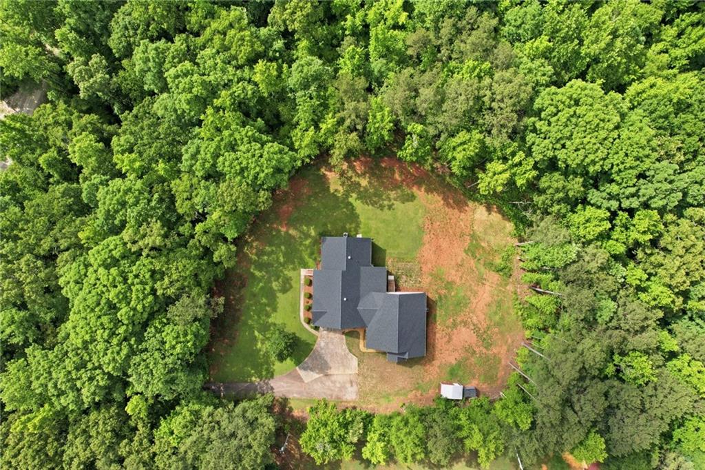 314 Coady Road Jackson, GA 30233 - Photo 4 of 31 a building view with a garden space