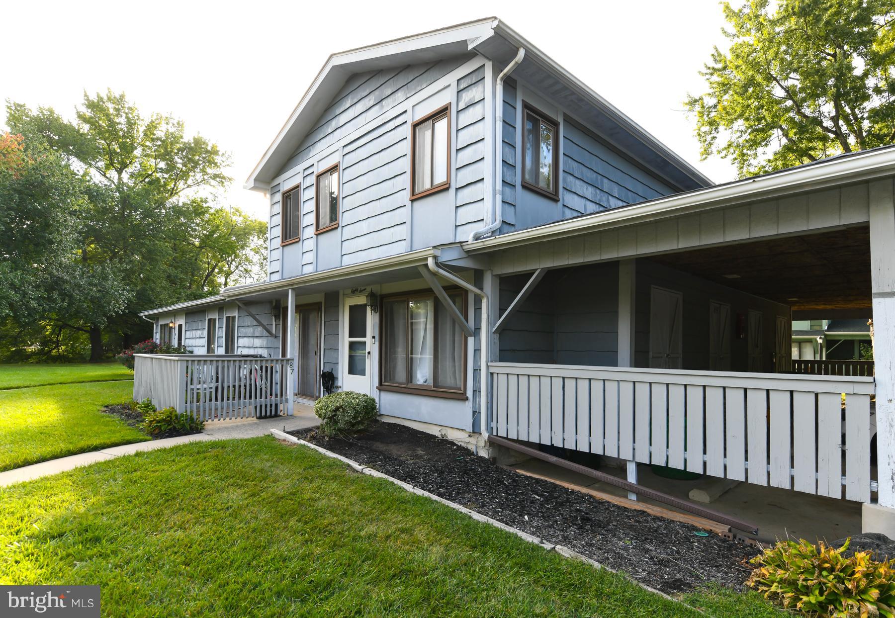 87 Woodway Drive West Deptford, NJ 08066 - Photo 1 of 18 a view of a house with a yard and a garden
