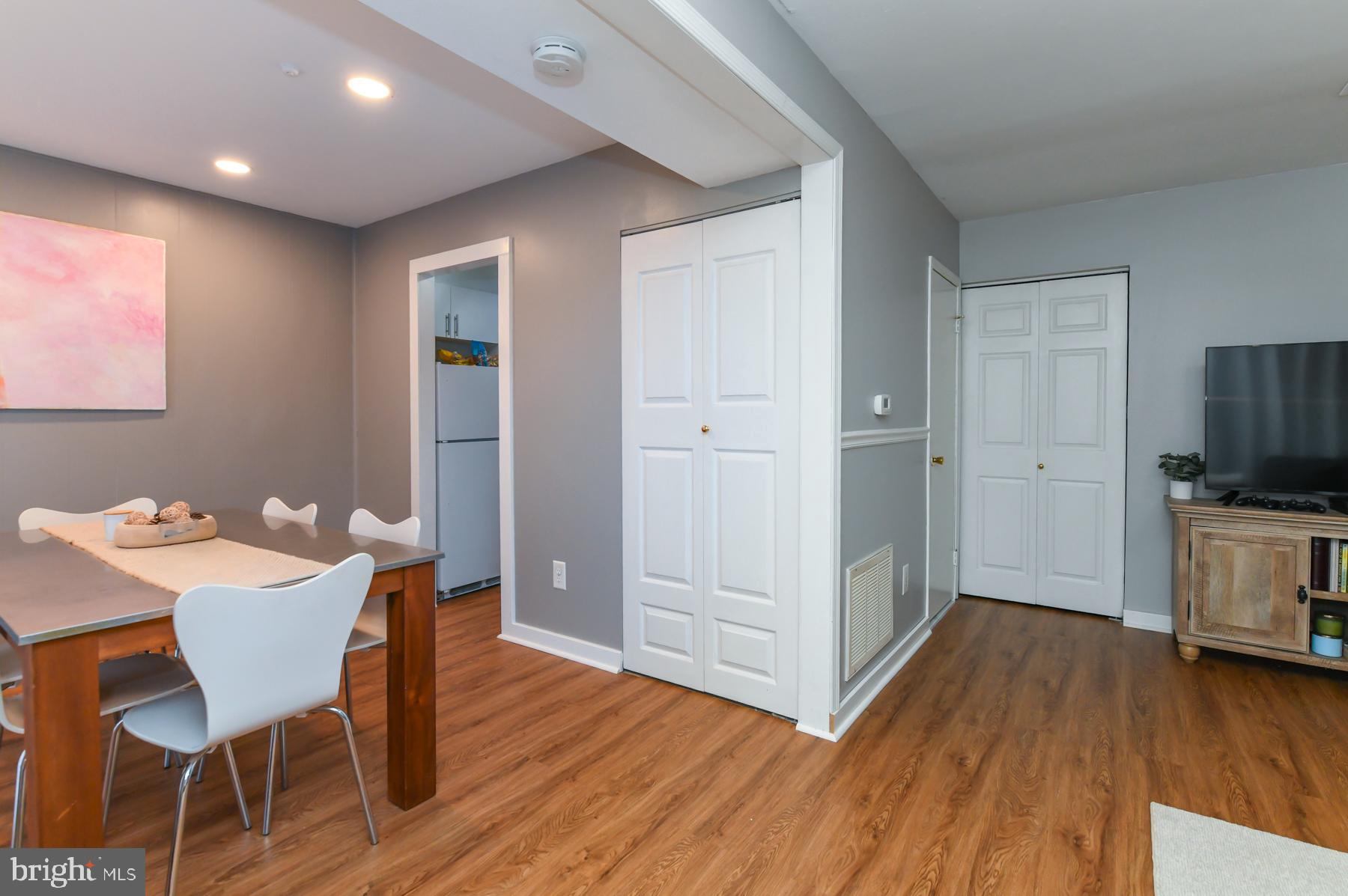 87 Woodway Drive West Deptford, NJ 08066 - Photo 11 of 18 a view of a kitchen and an empty room with wooden floor