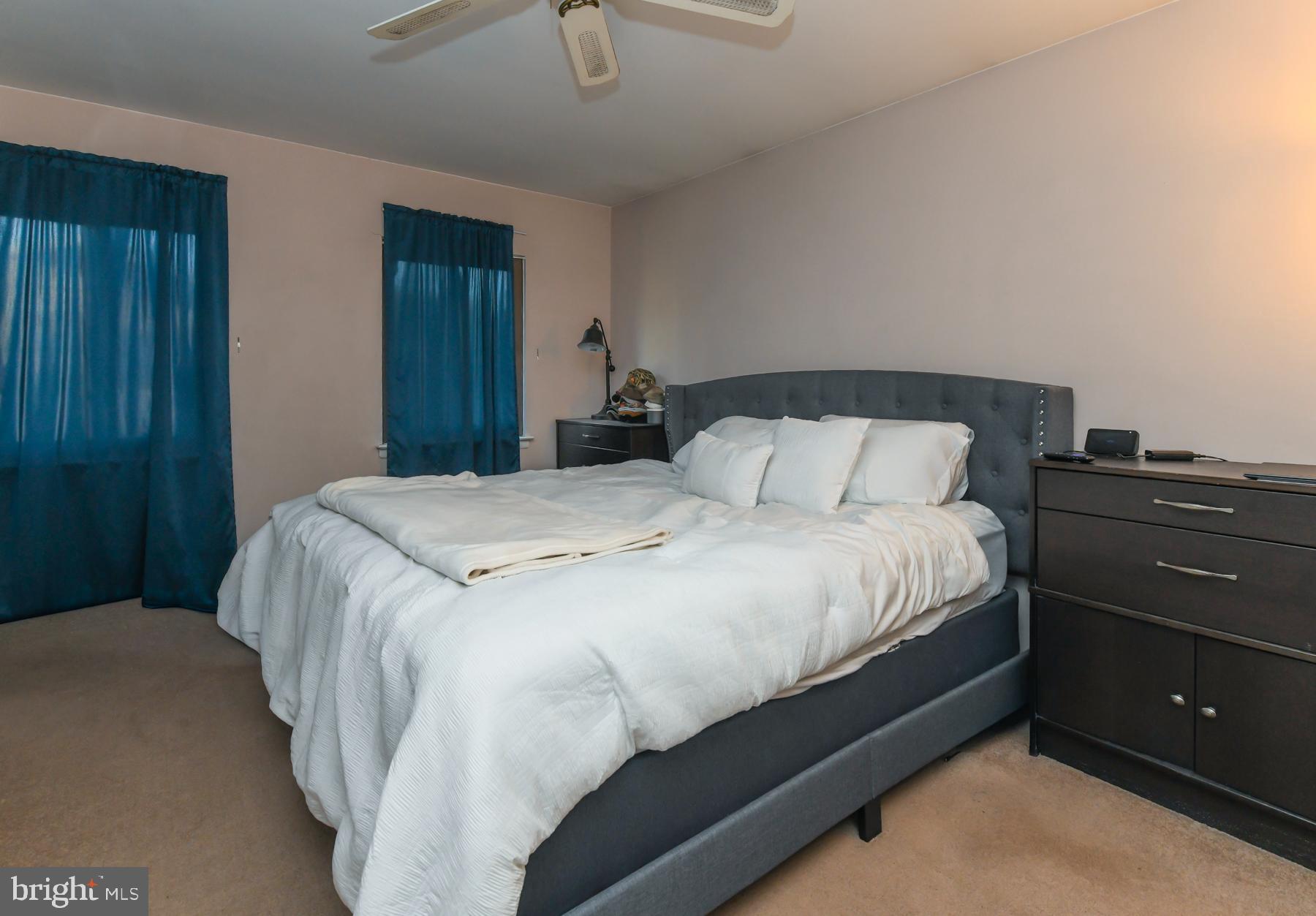 87 Woodway Drive West Deptford, NJ 08066 - Photo 14 of 18 a bedroom with a bed and a night stand