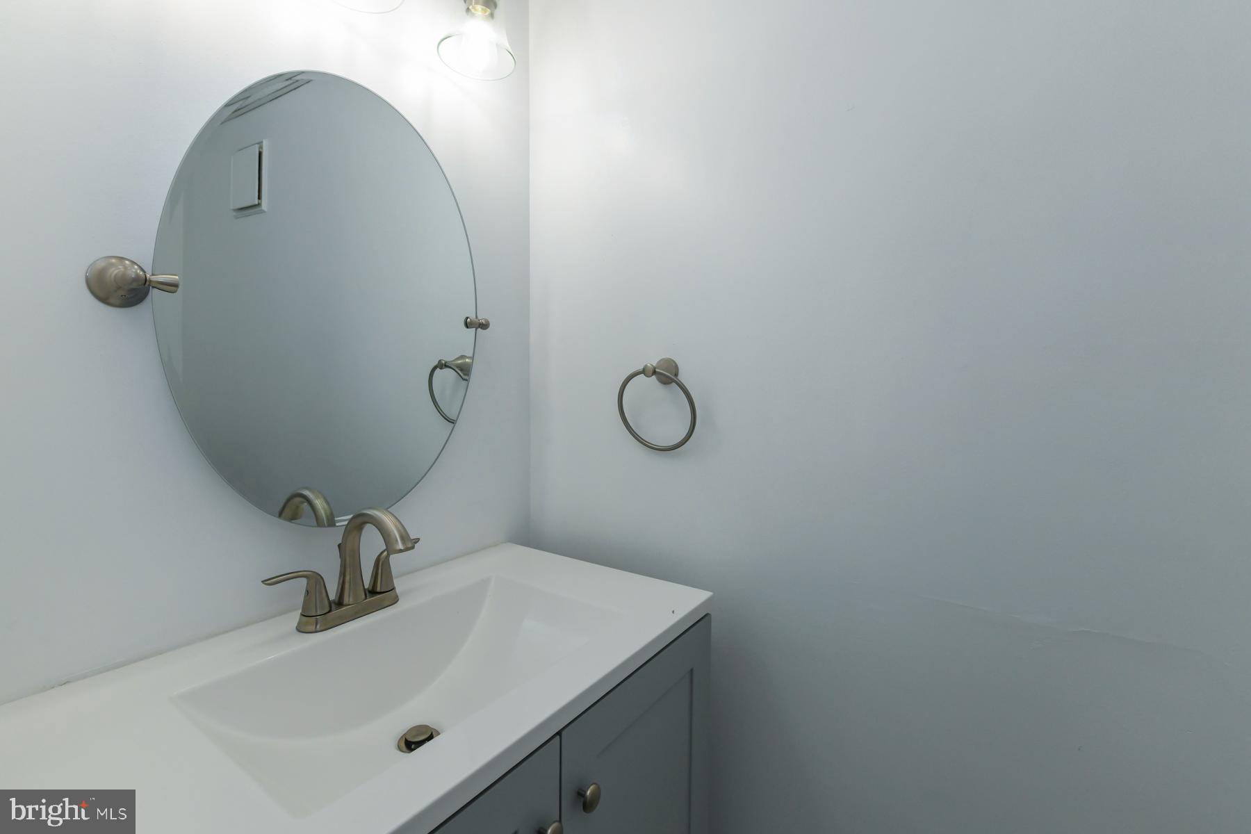 87 Woodway Drive West Deptford, NJ 08066 - Photo 17 of 18 a bathroom with a sink and mirror