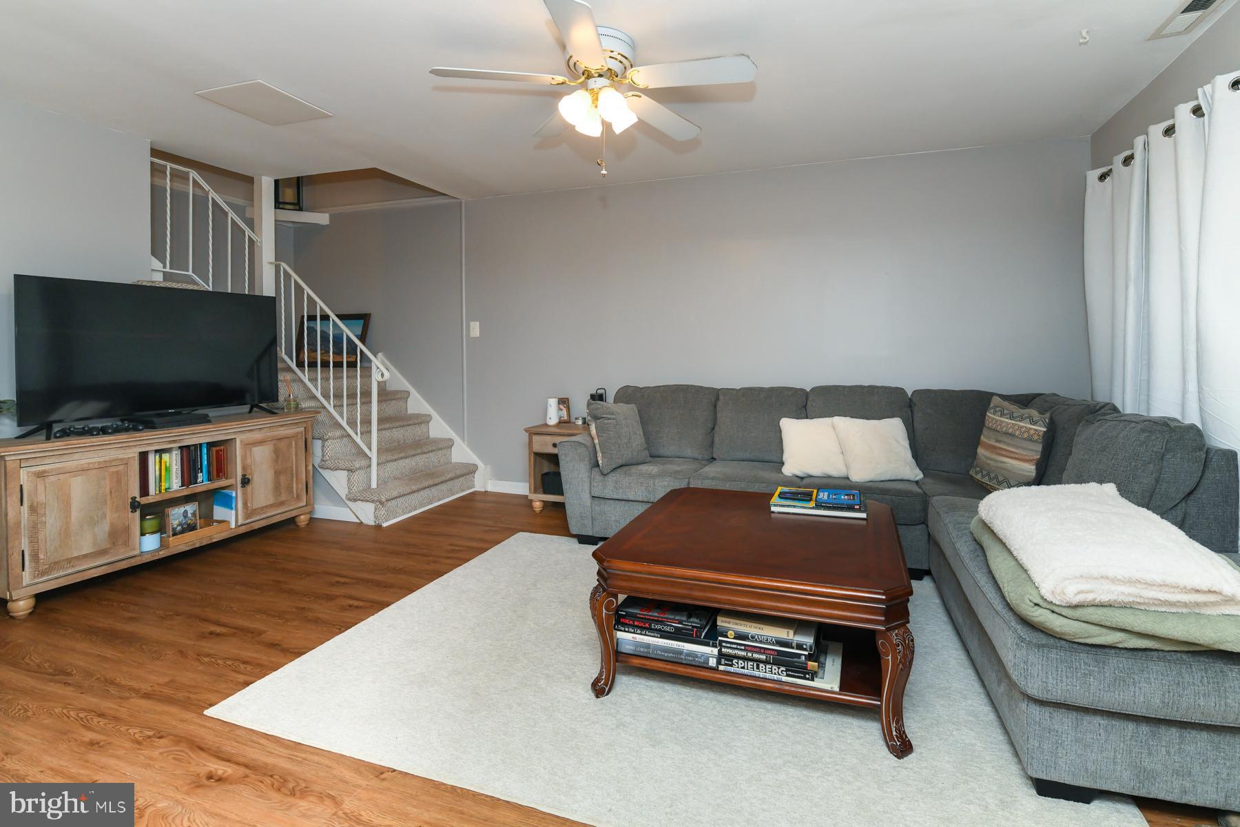 87 Woodway Drive West Deptford, NJ 08066 - Photo 8 of 18 a living room with furniture and a flat screen tv