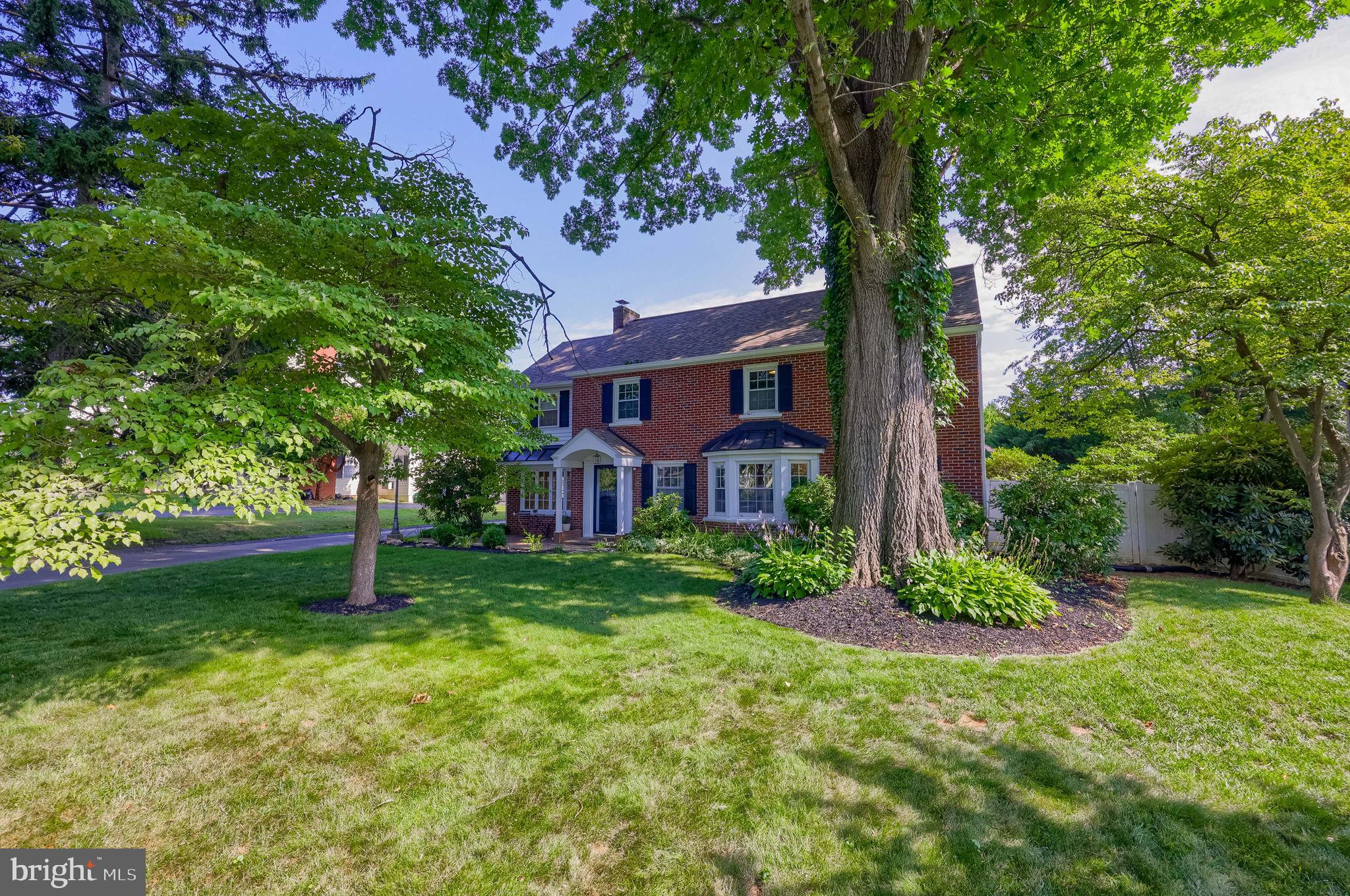 1709 Ridgeview Avenue Lancaster, PA 17603 - Photo 8 of 77 Charming brick home amidst lush greenery.