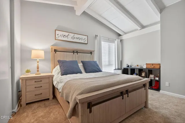 a bed room with a bed and a dresser