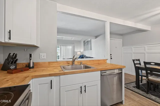 a kitchen with a sink and cabinets