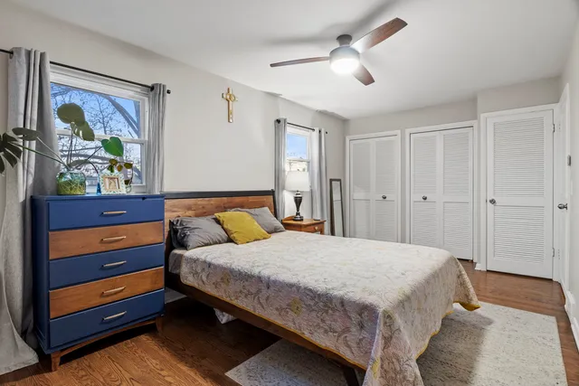 a bedroom with a bed and a dresser in it