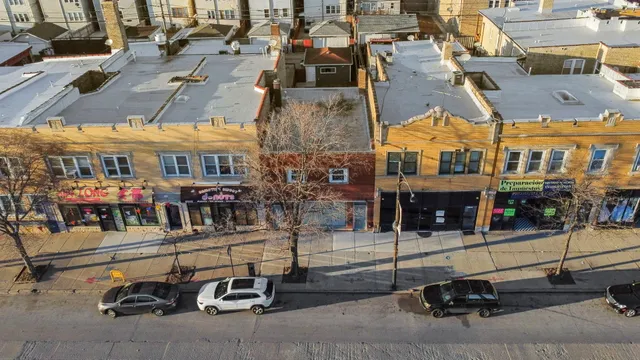 a view of a patio with table and chairs