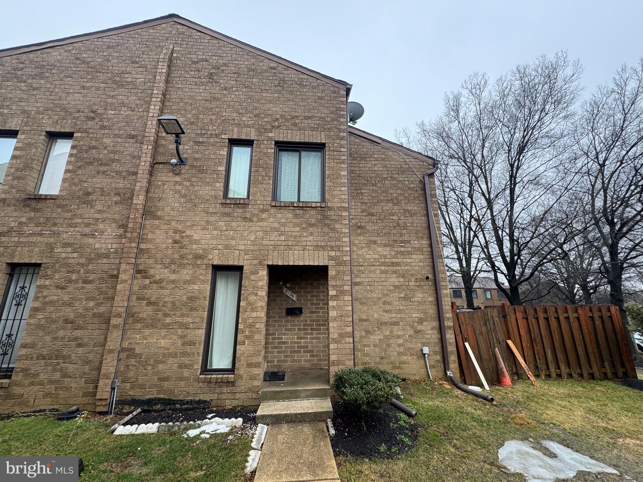 3106 Berry Road Northeast, Unit 20 Washington, DC 20018 - Photo 1 of 3 a front view of a house with garden