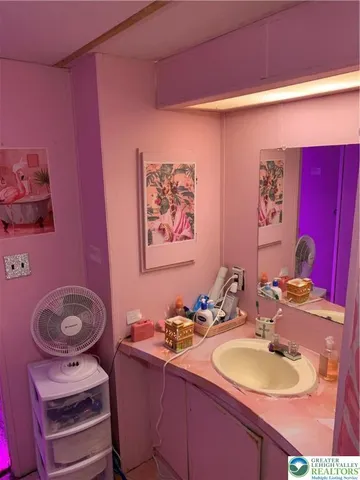 a bedroom with a bed and walk in closet