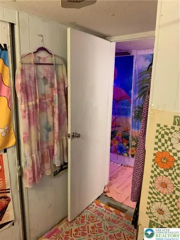 a bedroom with a bed and a potted plant