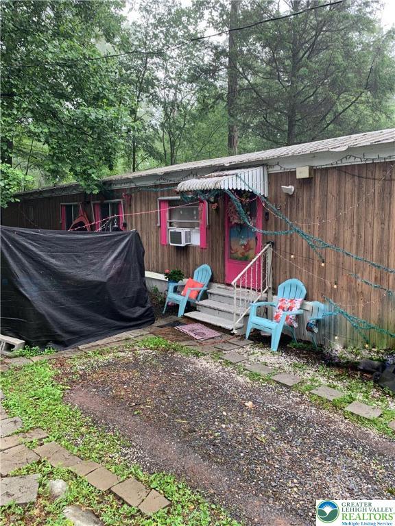 127 Pine Cone Trail Scotrun, PA 18355 - Photo 19 of 24 a view of a wooden house with a yard