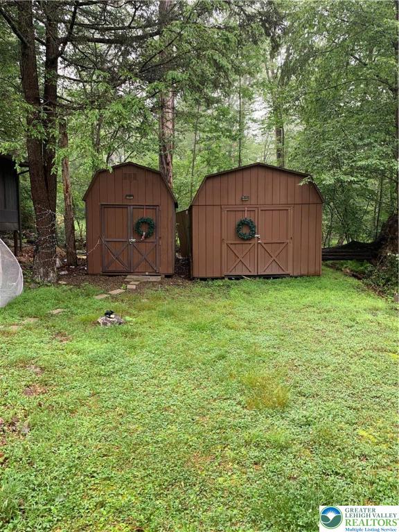 127 Pine Cone Trail Scotrun, PA 18355 - Photo 21 of 24 a view of a barn in the middle of a yard