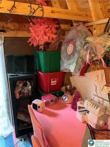 a view of a patio with a table and chairs under an umbrella