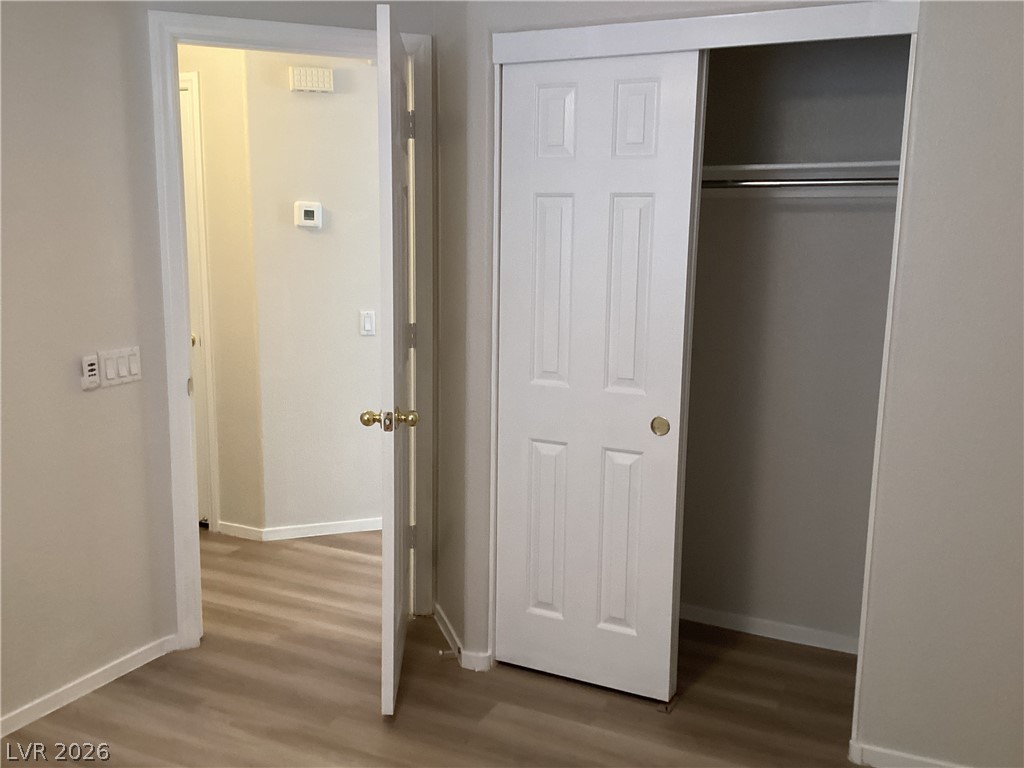 2135 Hidden Ranch Terrace Henderson, NV 89052 - Photo 15 of 27 Functional layout featuring a closet with sliding doors and easy-care laminate flooring.