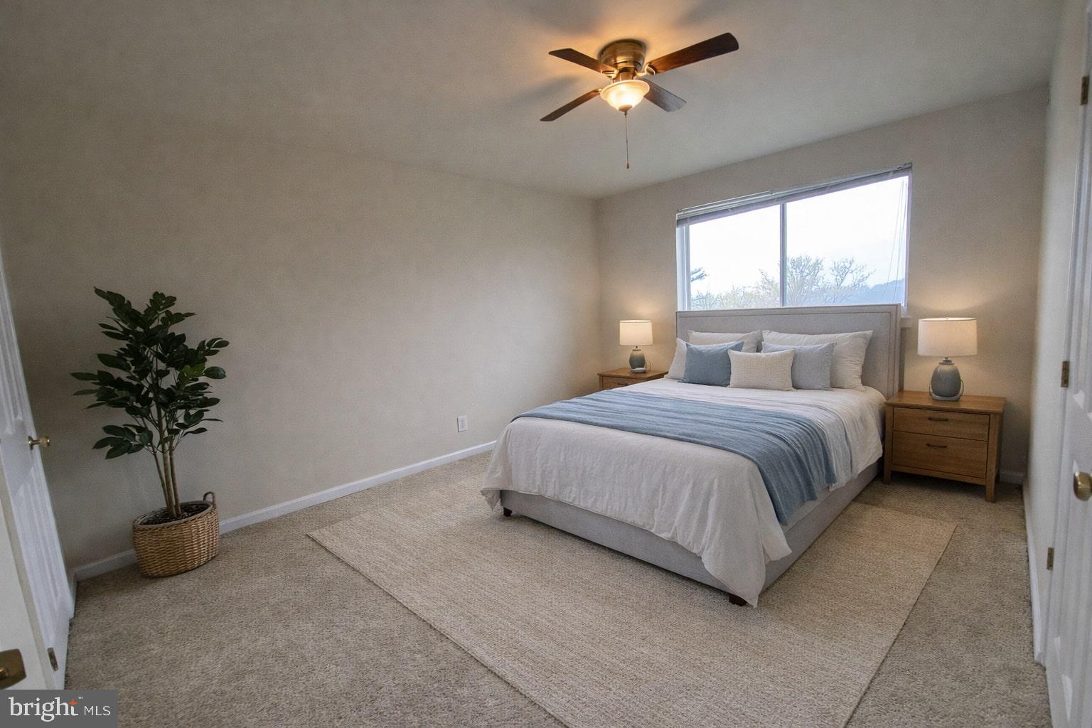 7514 Hawthorne Street, Unit 5 Landover, MD 20785 - Photo 12 of 16 a bedroom with a bed dresser and a window